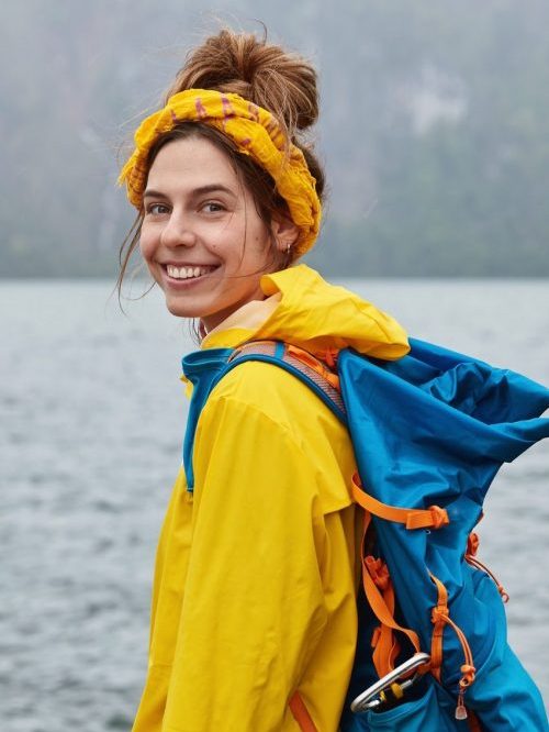 beautiful-european-female-traveler-has-touristic-route-explores-scenic-landscape-poses-near-river-e1631428009769.jpg